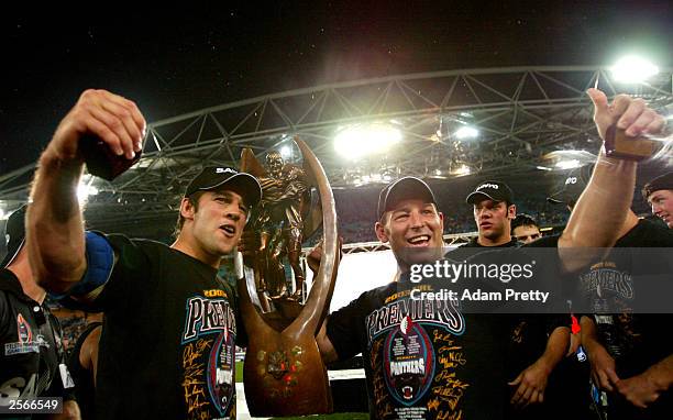 Ryan Girdler and Craig Gower of the Panthers celebrates victory after the NRL Grand Final between the Sydney Roosters and the Penrith Panthers at...