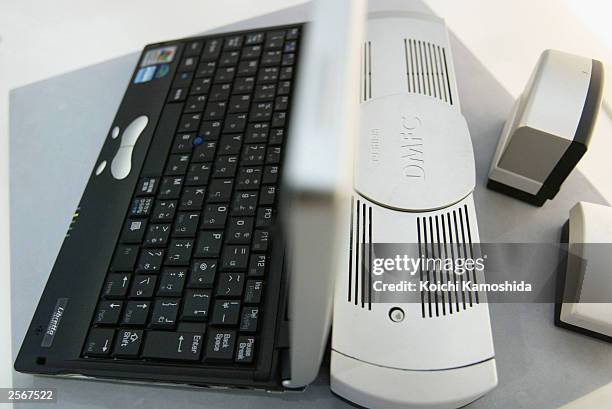 Direct methanol fuel cell for a mobile personal computer by Toshiba is attached to a computer at the CEATEC JAPAN JAPAN 2003 technology trade...