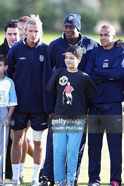 David Beckham, Emile Heskey and Kieron Dyer pose during the England training session at London Colney on October 7, 2003 in St Albans, London,...