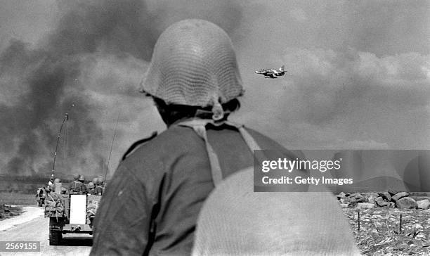 Israeli infantry advance under air cover into forward battle zones October 8, 1973 on the Golan Heights, two days into the Yom Kippur War. Israeli...