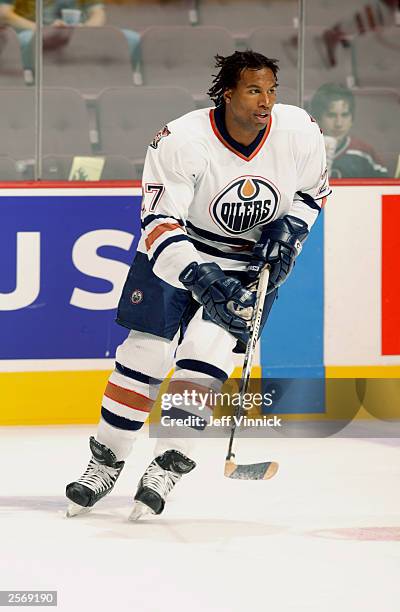 Right wing Georges Laraque of the Edmonton Oilers skates against the Vancouver Canucks during the preseason NHL game on September 30, 2003 at General...