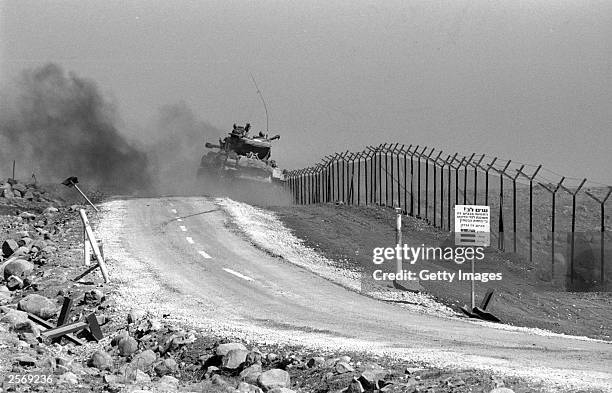 An Israeli tank patrols a stretch of the northern border October 11, 1973 on the Golan Heights during the Yom Kippur War. Israeli Prime Minister...