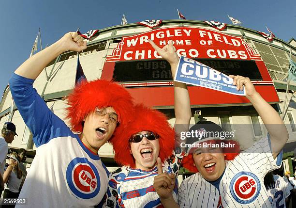 Victor Ireland, Jacob Peckerson and Sinhue Mendoda their loyalty to the Chicago Cubs before the Cubs play the Florida Marlins during game one of the...