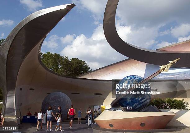 Guests enter "Mission: Space" at Walt Disney World's Epcot October 8, 2003 near Orlando, Florida.