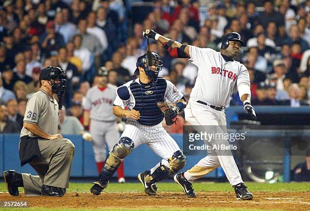 David Ortiz of the Boston Red Sox hits a two-run home run in the top of the forth inning against the New York Yankees during game 1 of the American...