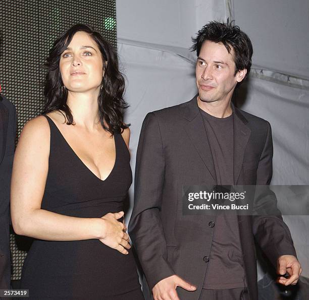 Actress Carrie-Anne Moss and actor Keanu Reeves attend a launch party for the worldwide DVD release of the film "The Matrix Reloaded" on October 8,...