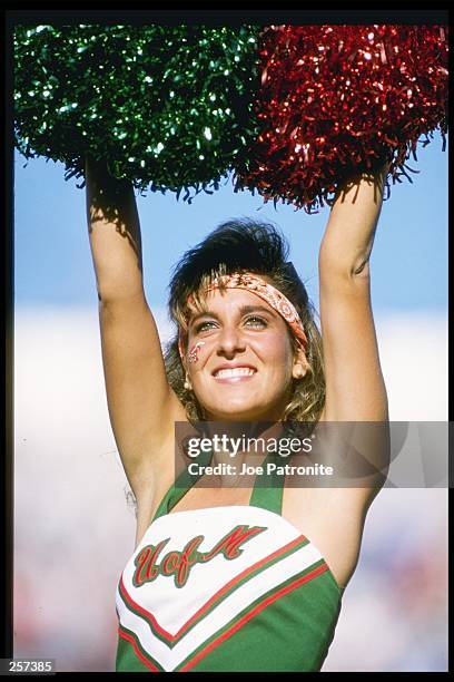 Cheerleader for the Miami Hurricanes watches her team during a game. Mandatory Credit: Joe Patronite /Allsport