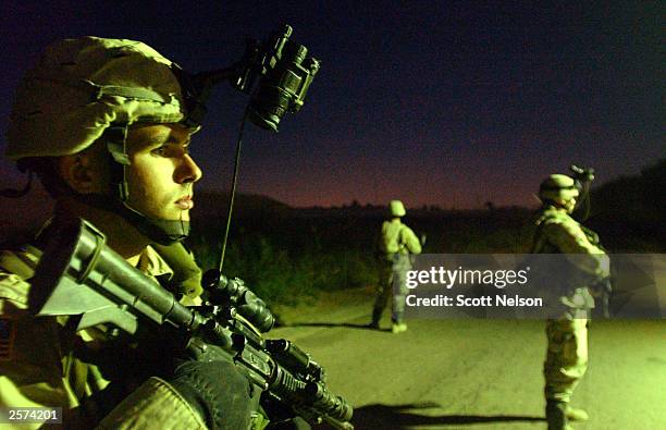 Army 82nd Airborne Division 1st battalion 504th regiment Staff Sergeant Jonathan Elliot, from Guyman, OK, helps cover his unit during an October 9,...