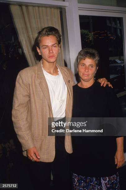 American actor River Phoenix with his arm around his mother, Heart, at a press conference, September 23, 1988.