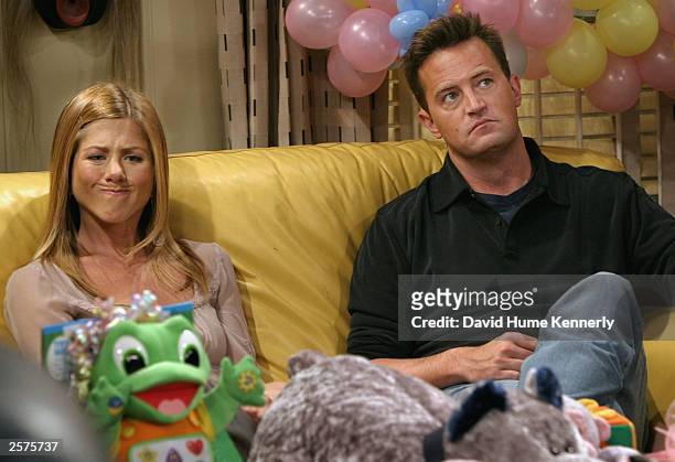 Jennifer Aniston makes a funny face as she sits with co-star Matthew Perry in between takes on the set of hit NBC series "Friends" September 12, 2003...