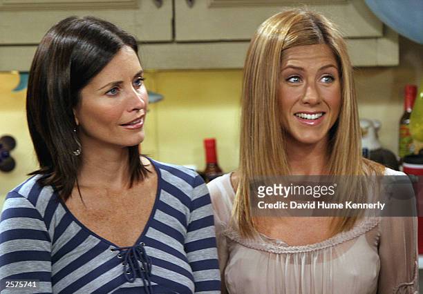 Co-stars Courteney Cox Arquette and Jennifer Aniston of the hit NBC series "Friends," perform during one of their last shows on the Warner Bros lot...