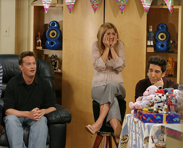 Matthew Perry , Jennifer Aniston, and David Schwimmer, cast members of the hit NBC series "Friends," react during a scene on one of their last shows...