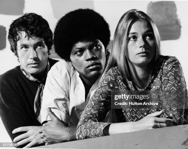 Promotional studio portrait of actors Michael Cole , Clarence Williams III and Peggy Lipton for the television series, 'The Mod Squad,' c. 1968.