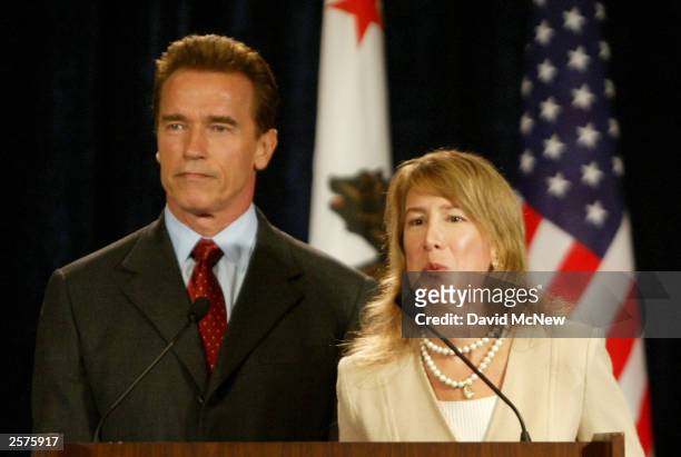 Donna Arduin , Director of the Office of Policy and Bugets, speaks to the media while California Republican Governor-elect Arnold Schwarzenegger...