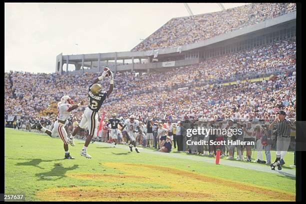 Split end Emmett Merchant of the Georgia Tech Yellow Jackets jumps up for the ball during a game against the Nebraska Cornhuskers at the Citrus Bowl...