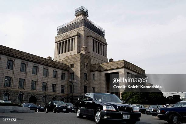 Members of the House of Representatives leave the Parliament Building by car on October 10, 2003 in Tokyo, Japan. Japanese Prime Minister Junichiro...