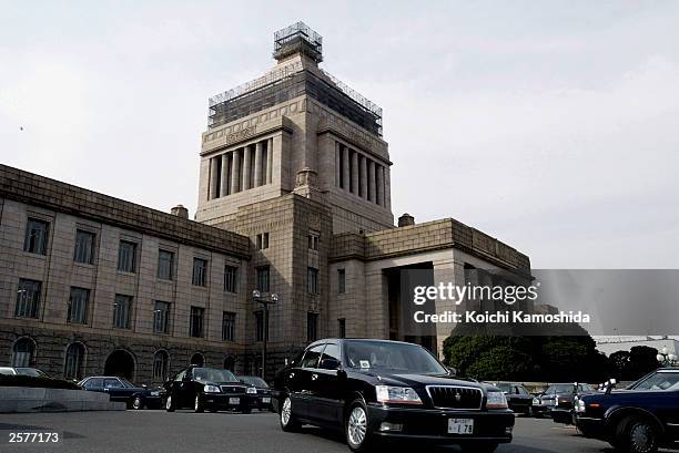 Members of the House of Representatives leave the Parliament Building by car on October 10, 2003 in Tokyo, Japan. Japanese Prime Minister Junichiro...