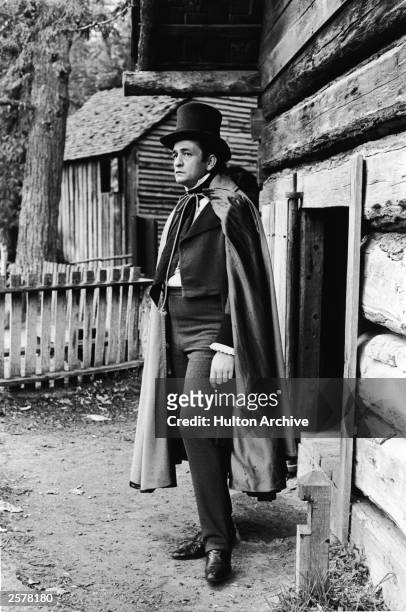 American country singer Johnny Cash stands in costume as Cherokee chief John Ross in a still from the historical television film, 'The Trail of...