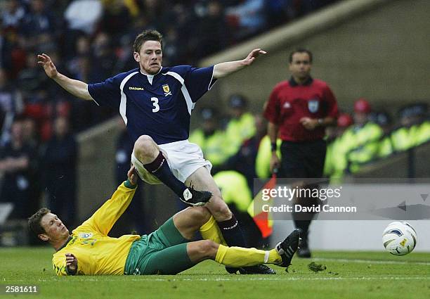 Gary Naysmith of Scotland clashes with Tomas Razanauskas of Lithuania during the UEFA Euro 2004 Qualifying match between Scotland and Lithuania at...