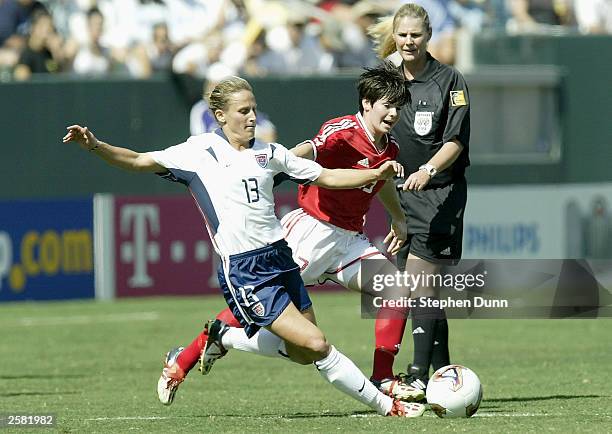 Kristine Lilly of USA battles Diana Matheson of Canada for the ball during the third place match of the FIFA Women's World Cup on October 11, 2003 at...