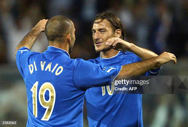Italy's striker Marco Di Vaio celebrates with teammate Francesco Totti after scoring against Azerbaijan during their Euro 2004 group 9 qualifyng...