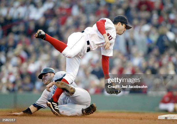 Karim Garcia of the New York Yankees slides into Todd Walker of the Boston Red Sox at second base during Game 3 of the 2003 American League...