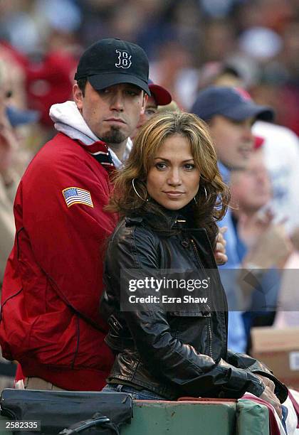 Actress/singer Jennifer Lopez and boyfriend, actor Ben Affleck watch the New York Yankees take on the Boston Red Sox during Game 3 of the 2003...