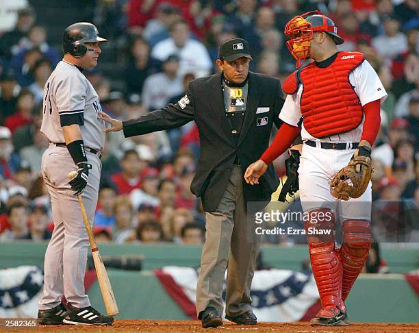 Karim Garcia of the New York Yankees reacts to being hit by a pitch by Pedro Martinez of the Boston Red Sox during Game 3 of the 2003 American League...
