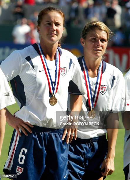 S Mia Hamm and Brandi Chastain wear their medals after their FIFA 2003 Women's World Cup third place match against Canada, 11 October 2003, in...