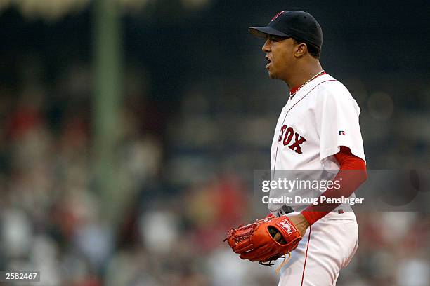 Starting pitcher Pedro Martinez of the Boston Red Sox has words for Karim Garcia of the New York Yankees after he slid into Todd Walker at second...