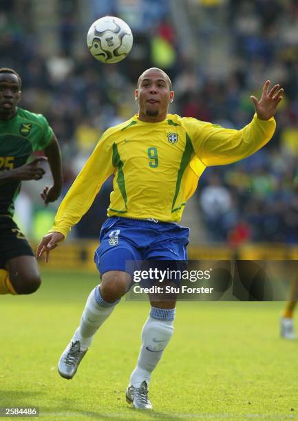 Brazilian striker Ronaldo takes on the Jamaican defence during the friendly match between Brazil and Jamaica at The Walkers Stadium on October 12,...