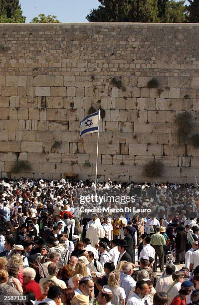 Ultra-orthodox Jews gather together during the ritual of the Kohanim at the Western Wall during the celebration of the Jewish festival of Sukkoth...