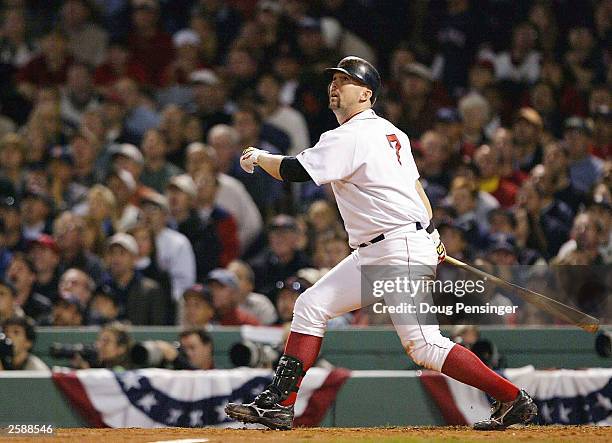 Trot Nixon of the Boston Red Sox watches the ball after hitting a double off the green monster in the seventh inning of Game 4 of the 2003 American...