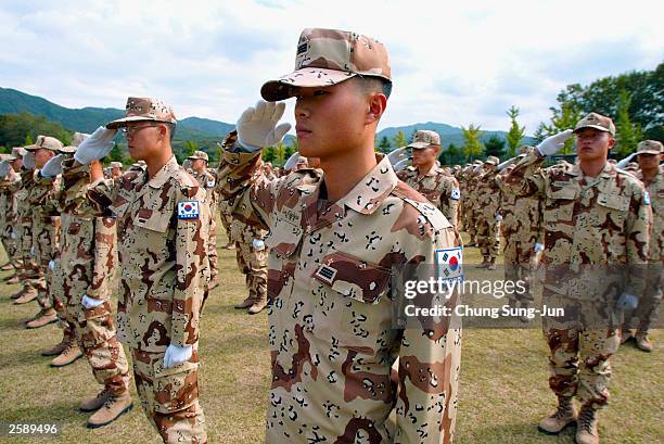 South Korean military soldiers salute during a departure ceremony at a military base in Gwangju county on October 14 south of Seoul, South Korea. 460...