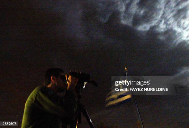 Greek borderguard screens the area near Evros river by a nightview vedio camera during a patrol at the Greek side of the river which separates Greece...