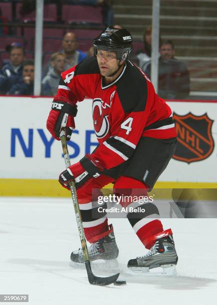 Defenseman Scott Stevens of the New Jersey Devils carries the puck against the New York Rangers during the preseason NHL game on October 3, 2003 at...