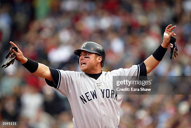 Karim Garcia of the New York Yankees advances to third base off of a single hit by teammate Alfonso Soriano in the second inning of Game 5 of the...