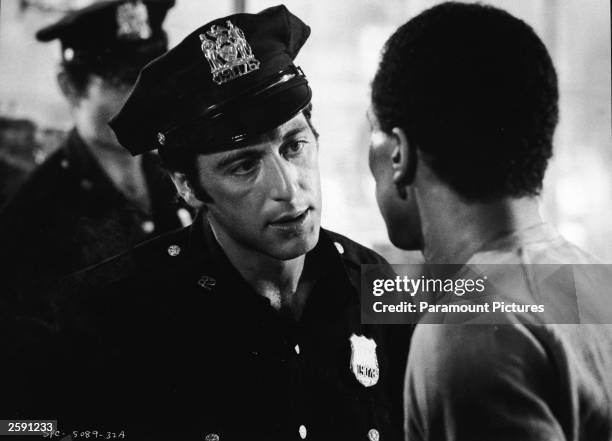 Al Pacino, in police uniform, talks to Damien Leake in a still from the film, ''Serpico,'' directed by Sidney Lumet, 1973.