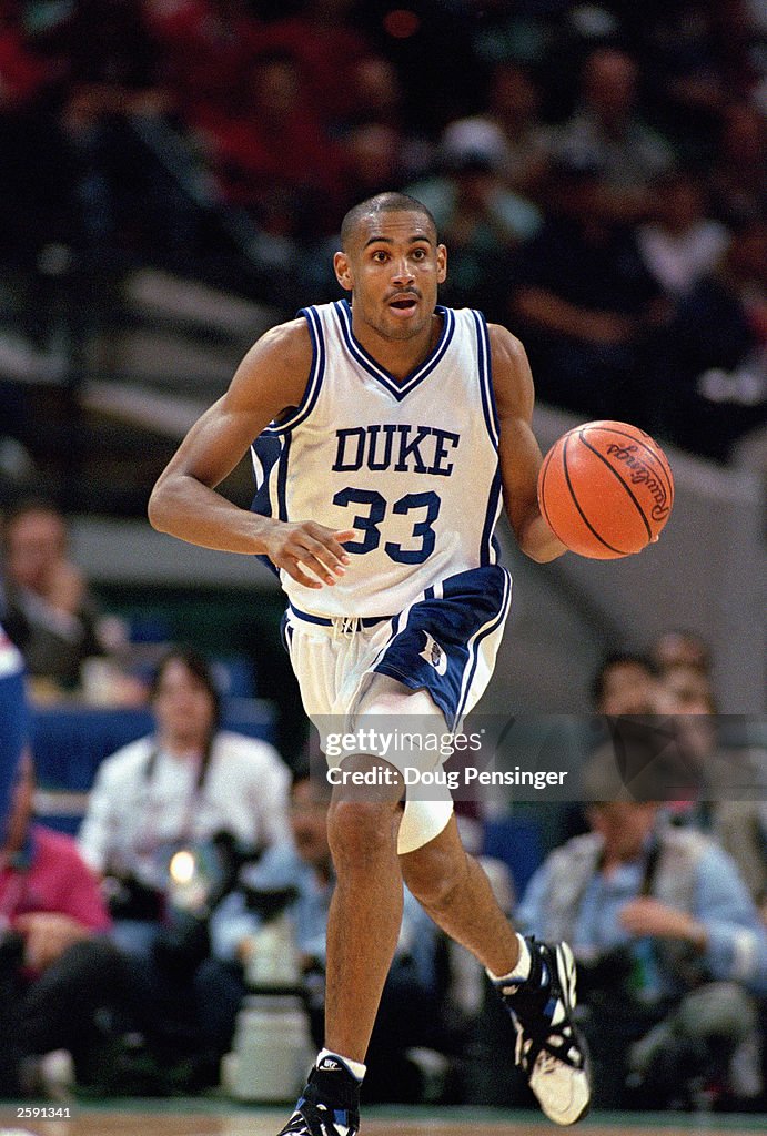 Grant Hill drives the ball downcourt