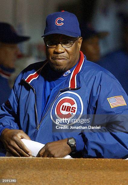 Manager Dusty Baker of the Chicago Cubs watches from the dugout in the first inning against the Florida Marlins in Game 6 of the National League...