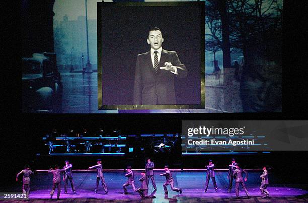 The image of singer Frank Sinatra appears on 40 foot high movable panels and screens as stage performers dance during rehearsals for the "Sinatra:...