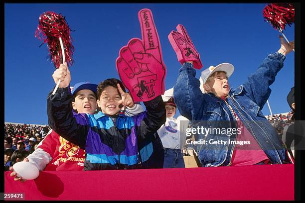 Fans of the Texas Tech Red Raiders celebrate during the John Hancock Bowl at the Sun Bowl in El Paso, Texas. Mandatory Credit: Allsport /Allsport