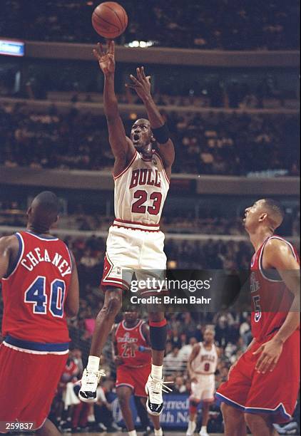 Guard Michael Jordan of the Chicago Bulls shoots the ball during a game against the Washington Bullets at the United Center in Chicago, Illinois. The...
