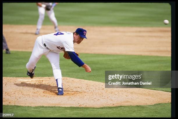 Nolan Ryan of the Texas Rangers throws a pitch during a game against the Chicago White Sox at Comiskey Park in Chicago, Illinios. Mandatory Credit:...