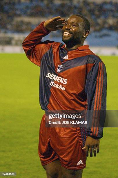 Jean -Calude Darcheville of Girondins de Bordeaux salutes to handfull of French fans as he celebrates his goal against Artmedia Petrzalka during the...