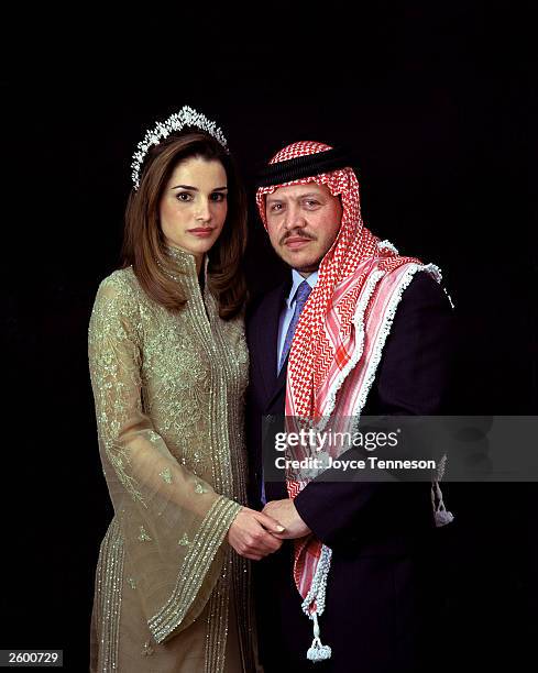 King of Jordan Abdullah II poses with his wife, Queen Rania on February 10, 2000 in Ahman, Jordan.
