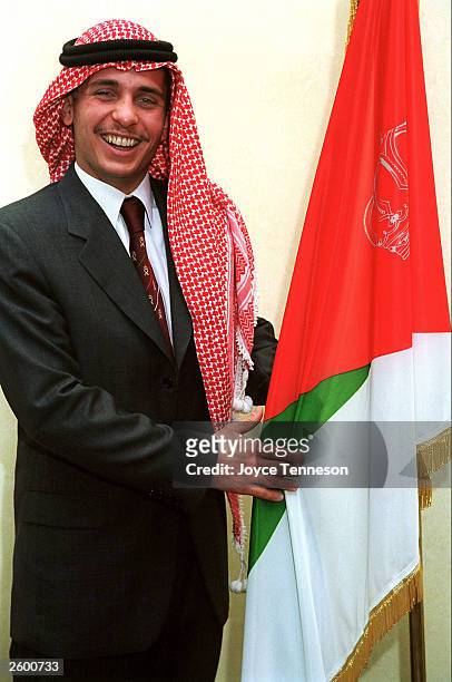 Crown Prince Hamzeh poses with flag on February 10, 2000 in Ahman, Jordan.