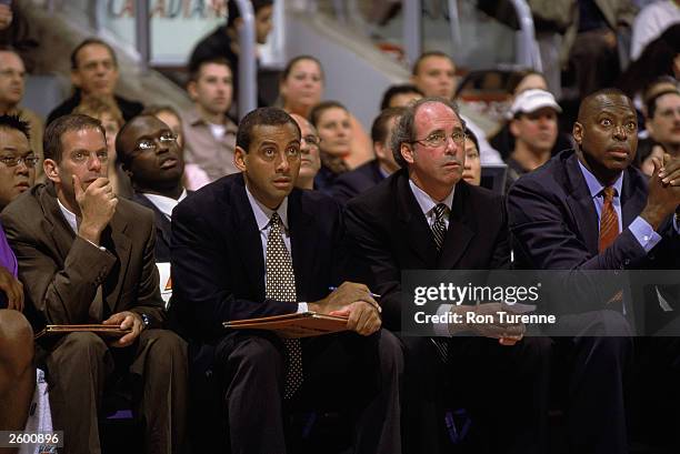 Head coach Kevin O'Neill of the Toronto Raptors watches the game against the Washington Wizards with his assistant coaches Jim Sann , Bob Beyer , and...