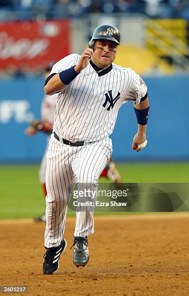 Karim Garcia of the New York Yankees rounds third base to score on an Alfonso Soriano two-run double in the forth inning against the Boston Red Sox...