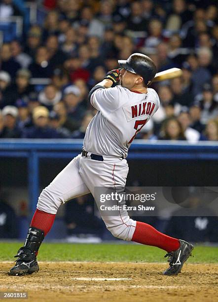 Trot Nixon of the Boston Red Sox hits a two-run home run against the New York Yankees in the ninth inning during game 6 of the American League...